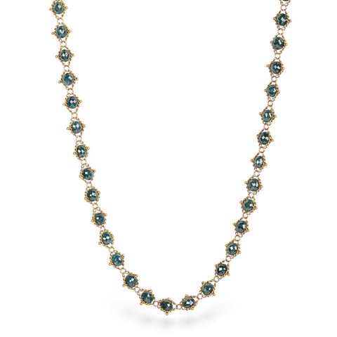 Necklace with blue diamonds on a white background