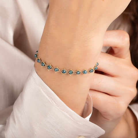 Bracelet with blue diamonds on a person