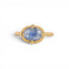 Gold ring with a blue dumortierite stone on a white background