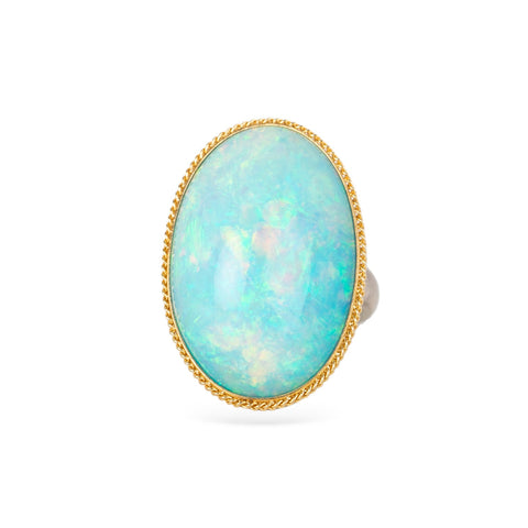 Ethiopian opal ring with gold bezel and sterling silver band