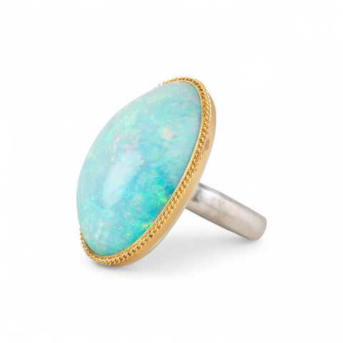 Ethiopian opal ring with gold bezel and sterling silver band