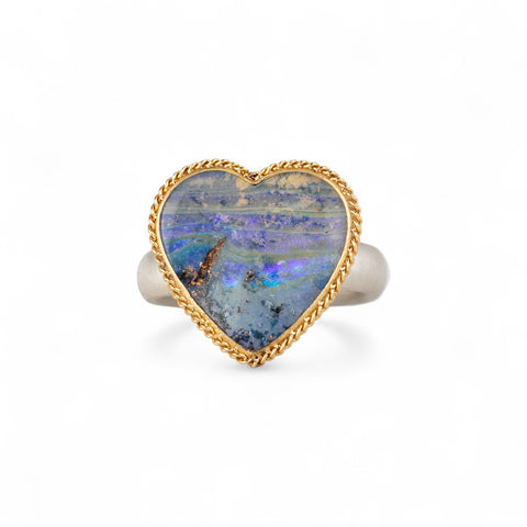 Boulder opal heart ring in an 18k gold bezel with sterling silver band