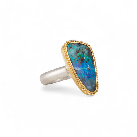 Handcrafted boulder opal ring with an 18k gold bezel and sterling silver band