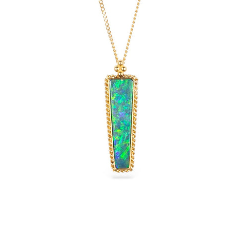 Australian Opal gemstone necklace with a gold setting against a white background