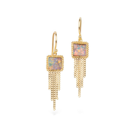 Gold earrings with boulder opal stones and chain fringes on a white background
