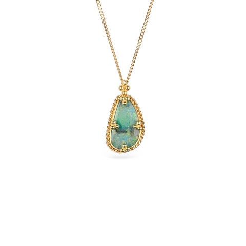 A handcrafted gold necklace featuring a boulder opal gemstone against a white background