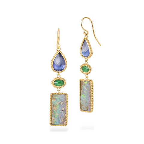 Pair of gold earrings with colorful gemstones on a white background