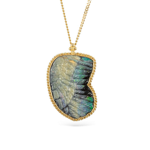 Gold necklace featuring a boulder opal carved into a wing on a white background