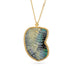 Gold necklace featuring a boulder opal carved into a wing on a white background