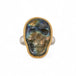 Carved labradorite skull ring set in an 18k gold bezel with a sterling silver band