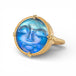 Gold ring with a carved face moonstone gemstone on a white background