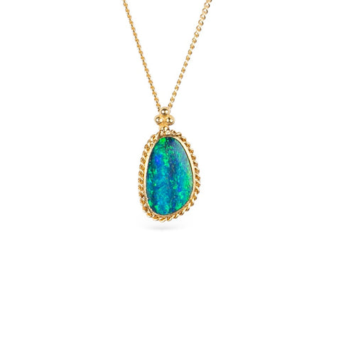 Australian opal and 18k gold necklace on a white background