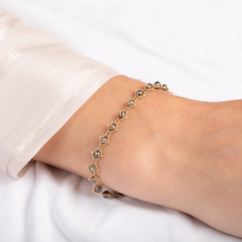 Delicate bracelet with champagne diamonds on a person