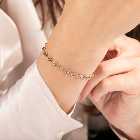 Gold bracelet with champagne diamonds on a person