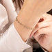 Gold bracelet with champagne diamonds on a person