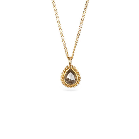 Handmade gold necklace with a natural-colored diamond on a white background