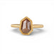 Gold ring with a brown diamond on a white background