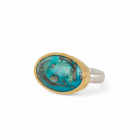 Handmade fine jewelry turquoise ring with an 18k gold bezel and sterling silver band