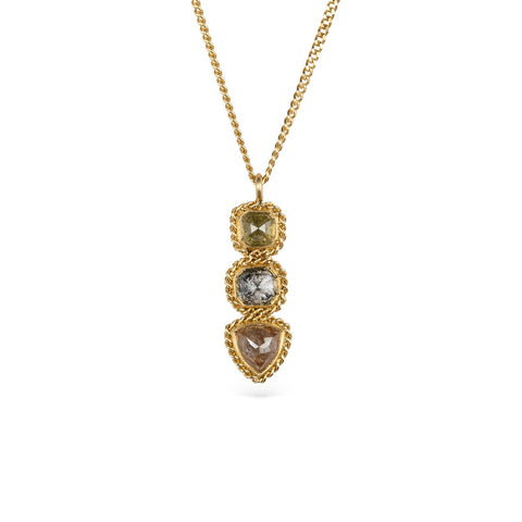 Gold necklace with a pendant featuring three different colored Diamonds on a white background