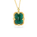 Gold necklace featuring an emerald gemstone on a white background