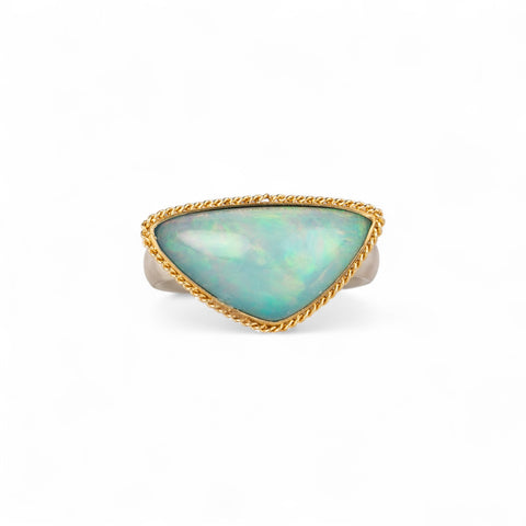 Ethiopian opal ring with gold bezel and sterling silver band