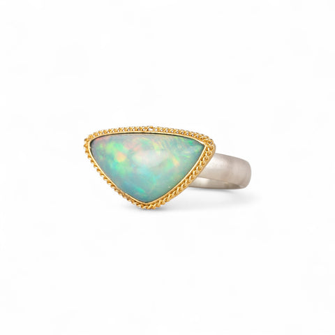 Ethiopian opal ring with gold bezel and sterling silver band