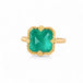 Gold ring with an emerald gemstone on a white background