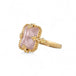 Gold ring with a morganite stone on a white background
