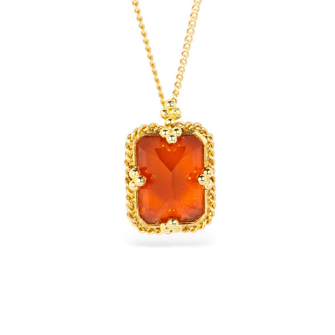 Gold necklace with a fire opal pendant on a white background