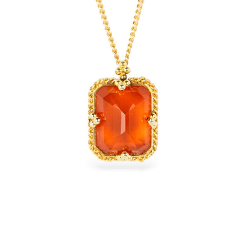 Gold necklace with a fire opal gemstone on a white background