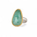 Ring featuring an emerald gemstone set in an 18k gold bezel with a silver band 