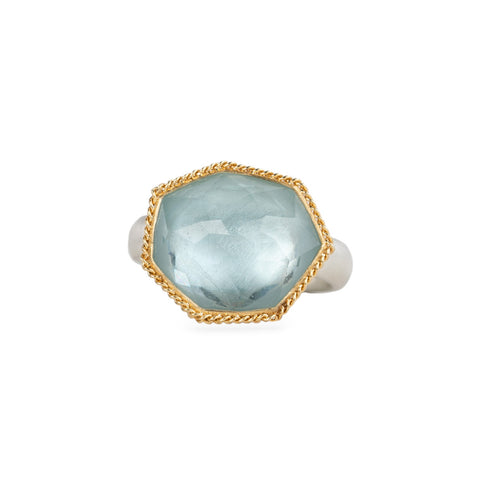Aquamarine ring with 18k gold bezel and sterling silver band on white background