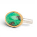 A gold and silver ring featuring an oval gem silica stone on a plain white background.