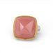 Gold and silver ring with pink guava quartz stone on a white background
