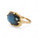 Gold ring with a labradorite gemstone on a white background