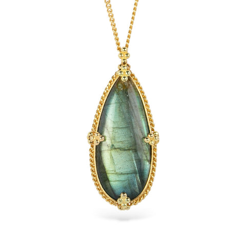 Gold necklace with a teardrop-shaped labradorite gemstone pendant on a white background
