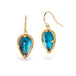 Pair of gold earrings with London blue topaz gemstones on a white background