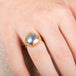 Gold ring with a mabe pearl on a hand
