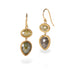 Gold earrings with natural-colored diamonds on a white background