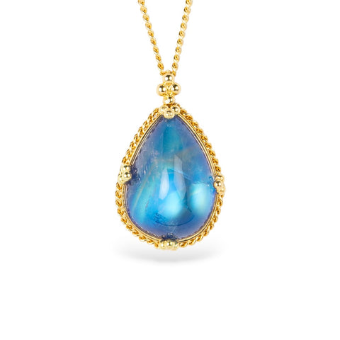 Blue moonstone teardrop pendant with gold frame on a white background