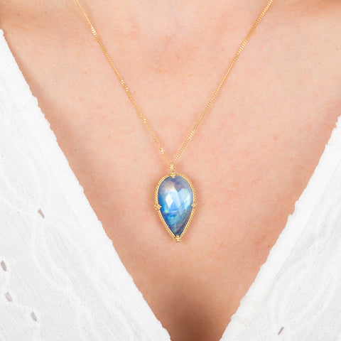 Necklace with a moonstone pendant on a white background