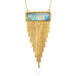 Gold necklace with a moonstone and fringe chains on a white background