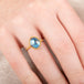Gold ring with a moonstone gemstone on a hand