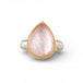 Gold and silver ring with pink morganite teardrop-shaped gemstone on a white background