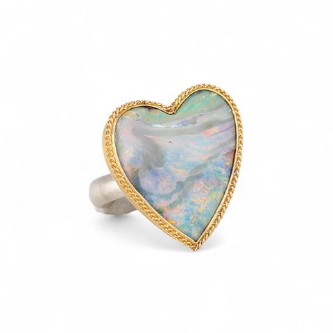 Handmade boulder opal heart ring with gold bezel and sterling silver band