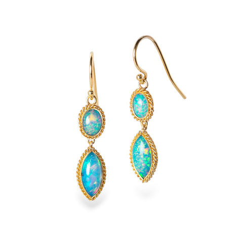 Gold earrings with ethiopian opal stones on a white background