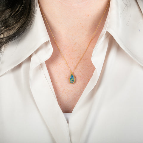 Handcrafted Australian opal and gold necklace on a person