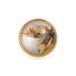 The face of a ring with rutilated quartz set in an 18k gold bezel, with a sterling silver band