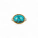 Turquoise ring with gold bezel and sterling silver band on white background