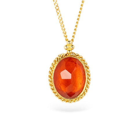 Gold necklace with an orange fire opal gemstone pendant on a white background